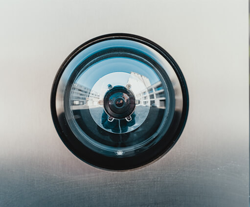 Close-up to security video camera lens.