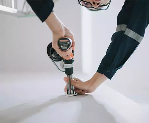 Technician installing a security camera